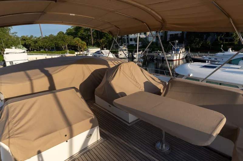 Slide: The Image of Covered deck area of a 1998 Grand Banks 46 Classic yacht in a marina. - 68