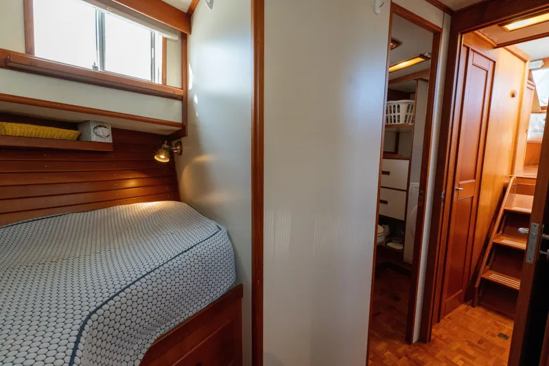 Slide: The Image of Cozy cabin interior of 1998 Grand Banks 46 Classic yacht with wooden finishes. - 36