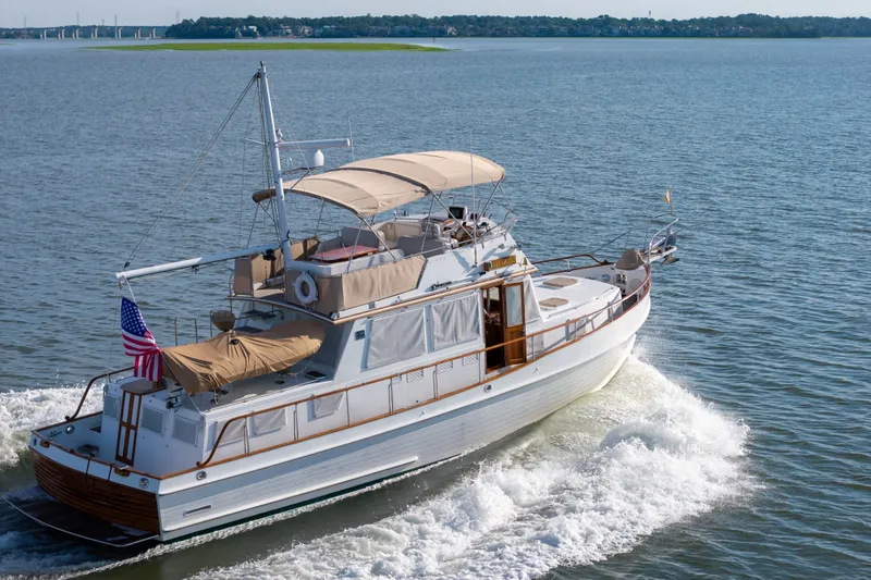 Slide: The Image of Grand Banks 46 Classic yacht cruising on open water, 1998 model. - 104