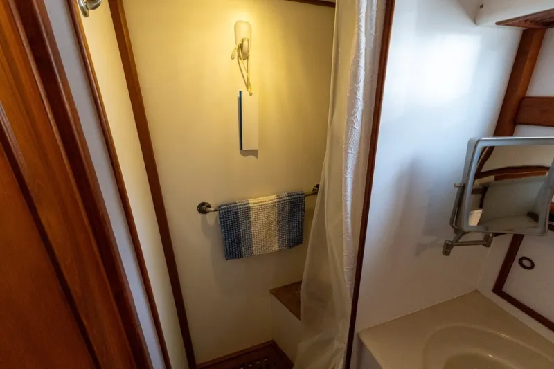 Slide: The Image of Bathroom interior of 1998 Grand Banks 46 Classic yacht with towel and mirror. - 37