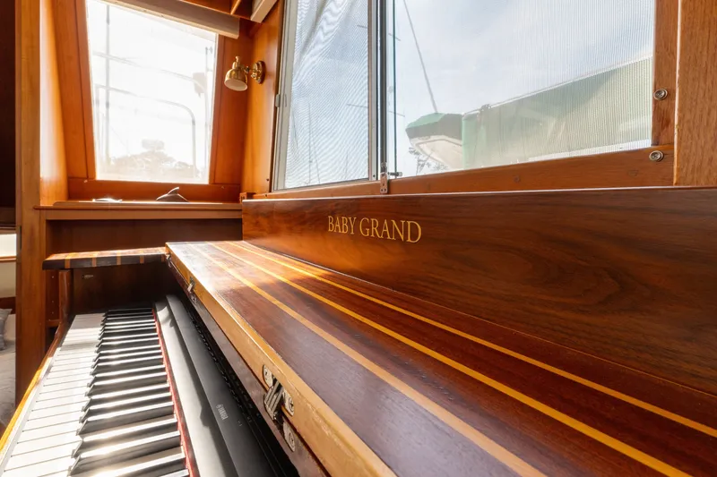 Slide: The Image of Wooden interior of 1998 Grand Banks 46 Classic yacht with a Baby Grand piano. - 11