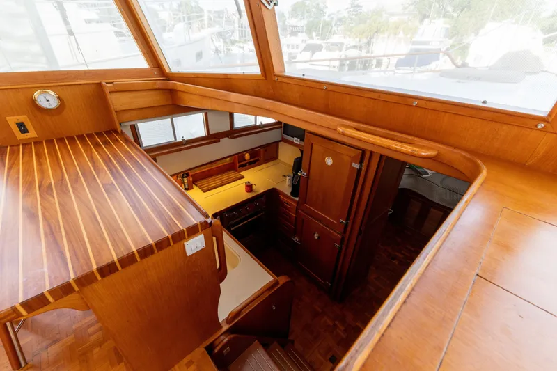 Slide: The Image of Interior view of 1998 Grand Banks 46 Classic yacht, showcasing wooden cabinetry and galley area. - 32
