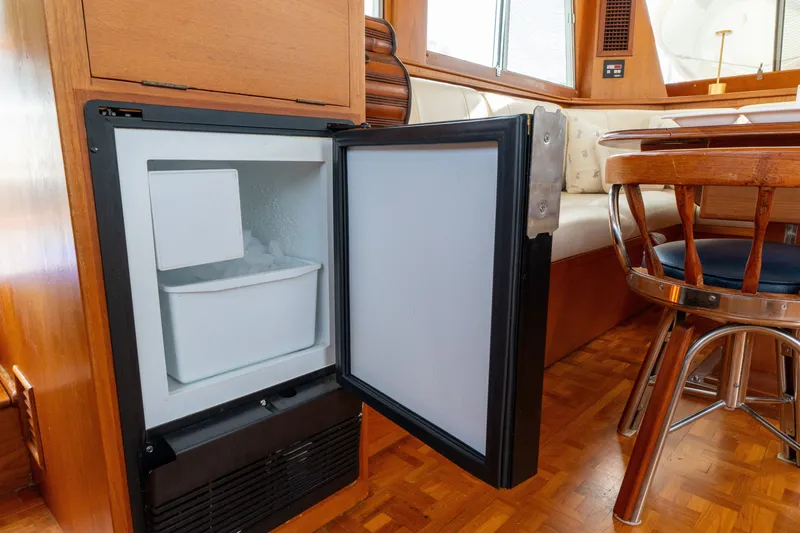 Slide: The Image of Open refrigerator in the cabin of a 1998 Grand Banks 46 Classic yacht. - 16