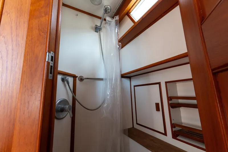 Slide: The Image of Shower area in 1998 Grand Banks 46 Classic yacht with wooden accents. - 50