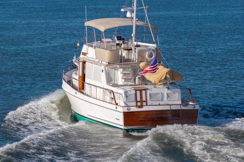 Slide: The Image of Grand Banks 46 Classic yacht cruising on open water, 1998 model. - 4