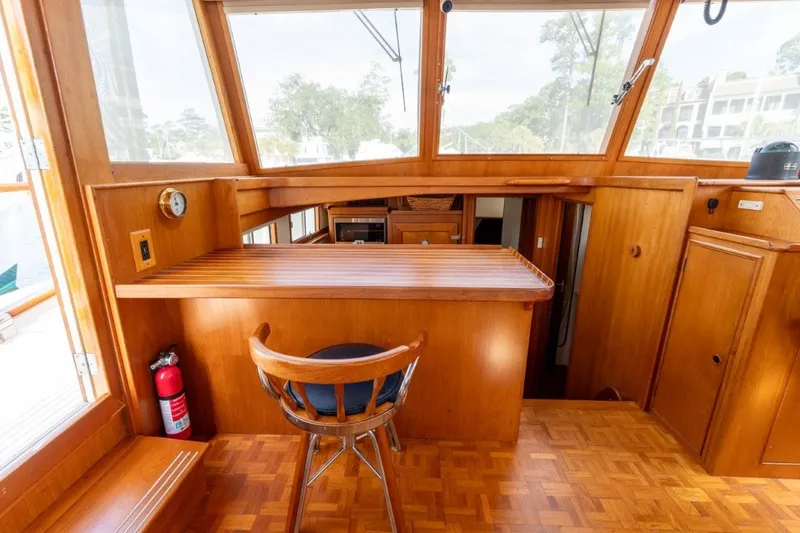 Slide: The Image of Interior of 1998 Grand Banks 46 Classic yacht with wooden furnishings and seating. - 14