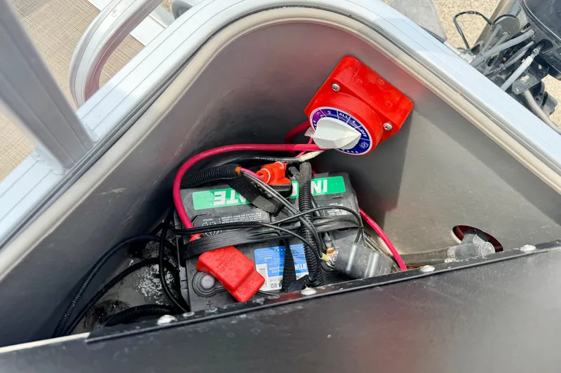 Slide: The Image of Battery compartment of 2022 Sun Tracker Bass Buggy 18 DLX with wiring and switch. - 27