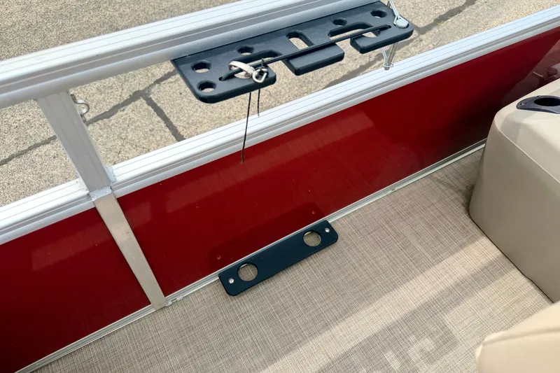 Slide: The Image of 2022 Sun Tracker Bass Buggy 18 DLX interior with red panel and beige flooring. - 55