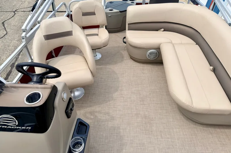 Slide: The Image of Interior of 2022 Sun Tracker Bass Buggy 18 DLX pontoon boat with beige seating. - 64