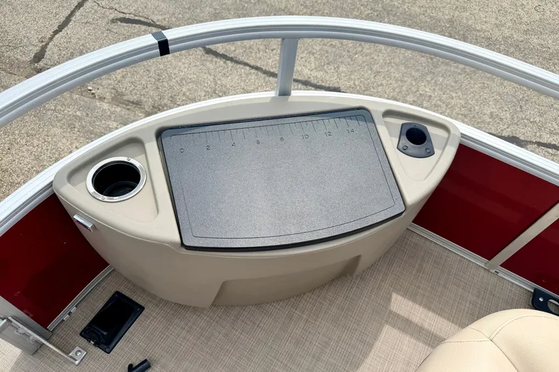 Slide: The Image of 2022 Sun Tracker Bass Buggy 18 DLX boat console with cup holder and measuring board. - 53