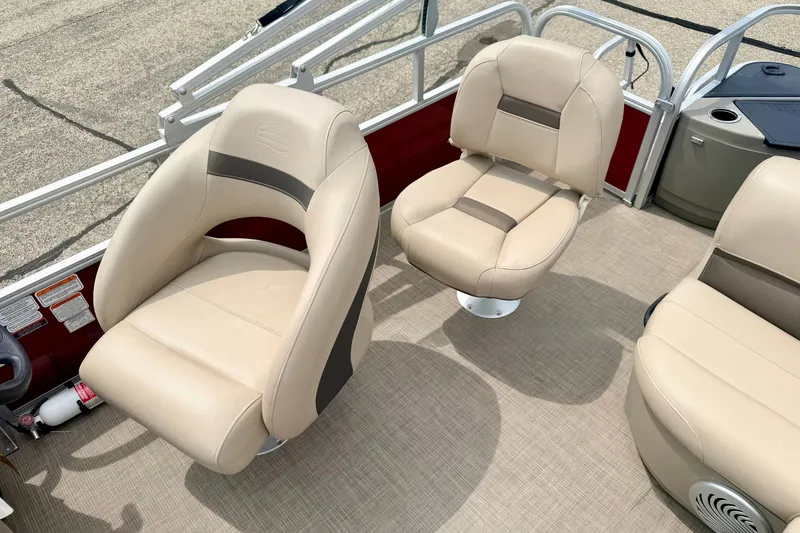 Slide: The Image of 2022 Sun Tracker Bass Buggy 18 DLX boat interior with beige seating and modern design. - 28