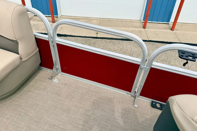 Slide: The Image of Interior view of 2022 Sun Tracker Bass Buggy 18 DLX pontoon boat with beige seating. - 65
