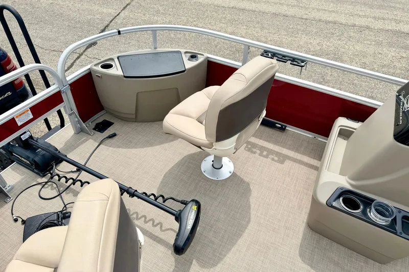 Slide: The Image of 2022 Sun Tracker Bass Buggy 18 DLX interior with seating and fishing equipment. - 51