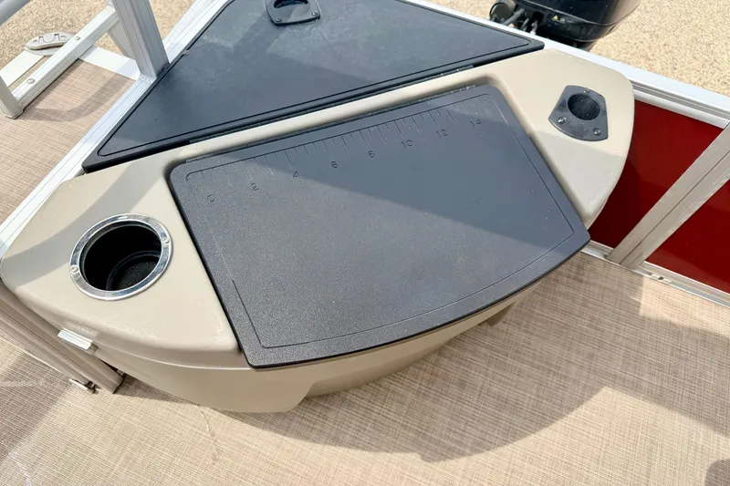 Slide: The Image of 2022 Sun Tracker Bass Buggy 18 DLX fishing station with cup holder and measuring board. - 24