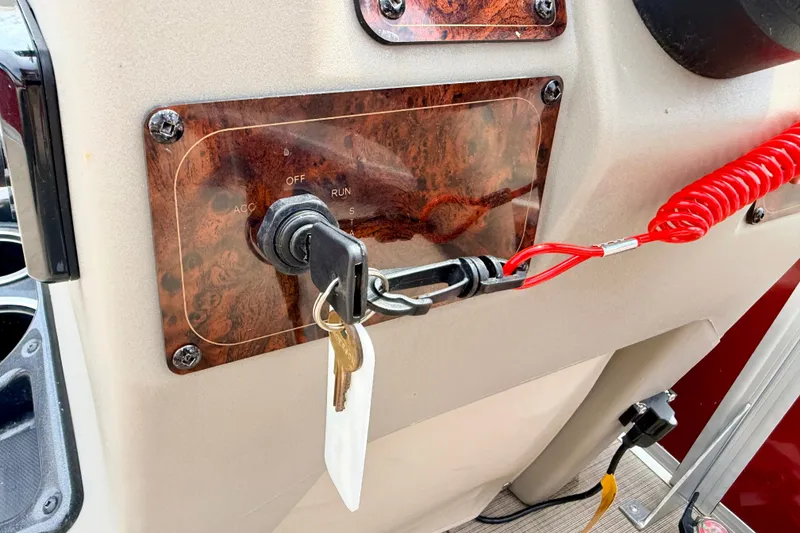 Slide: The Image of Ignition switch of 2022 Sun Tracker Bass Buggy 18 DLX with keys and safety lanyard. - 44