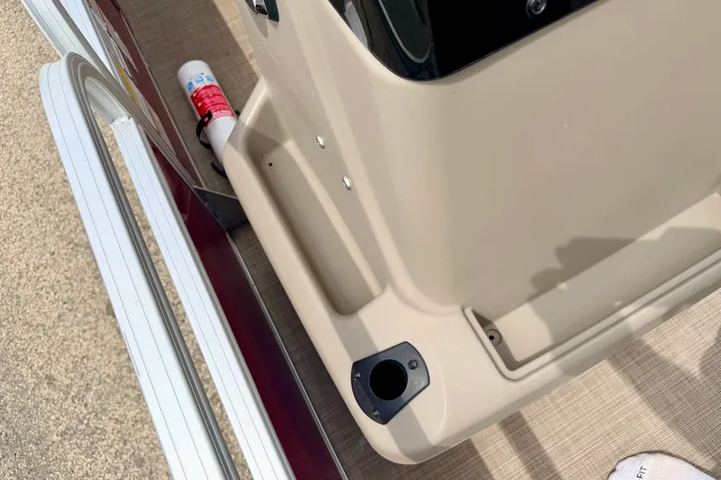 Slide: The Image of 2022 Sun Tracker Bass Buggy 18 DLX boat deck with fire extinguisher and railing. - 49