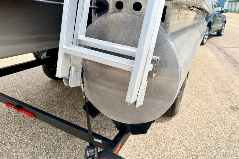 Slide: The Image of 2022 Sun Tracker Bass Buggy 18 DLX pontoon boat on trailer, rear view. - 20