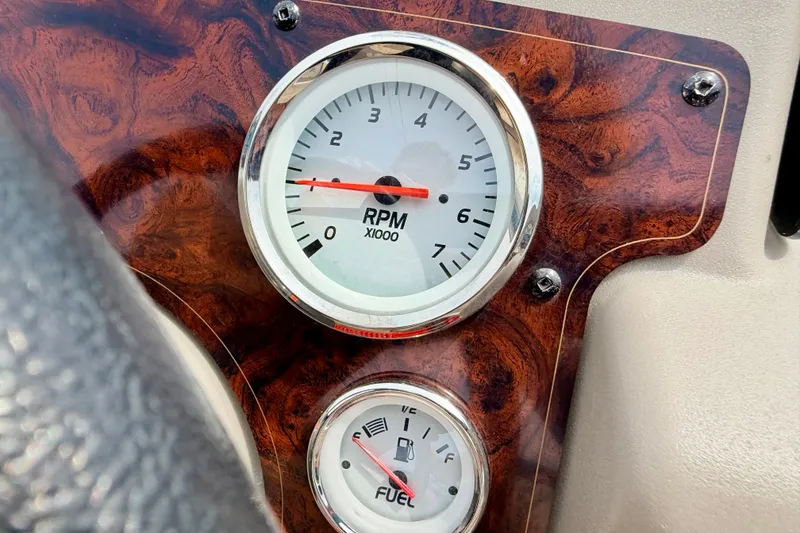 Slide: The Image of Dashboard of 2022 Sun Tracker Bass Buggy 18 DLX with RPM and fuel gauges. - 41