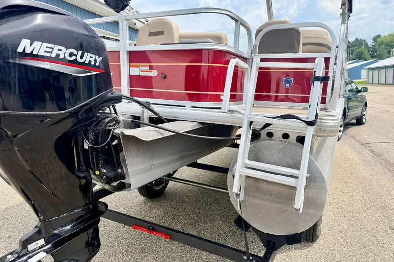 Slide: The Image of 2022 Sun Tracker Bass Buggy 18 DLX pontoon boat with Mercury engine and ladder. - 13