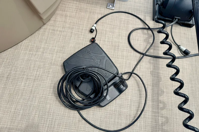 Slide: The Image of Foot pedal and cables on a 2022 Sun Tracker Bass Buggy 18 DLX boat deck. - 60