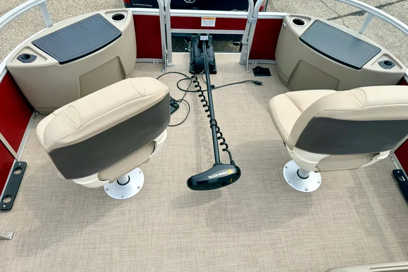 Slide: The Image of 2022 Sun Tracker Bass Buggy 18 DLX interior with two swivel seats and trolling motor. - 63