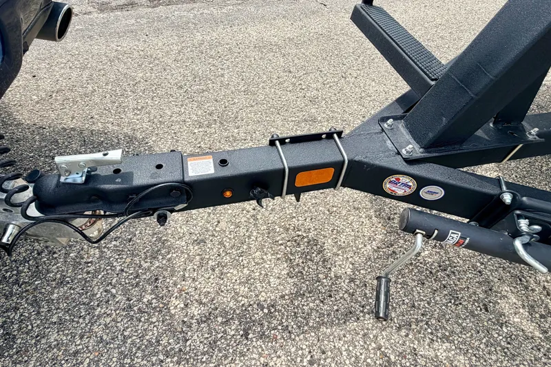 Slide: The Image of Trailer hitch of a 2022 Sun Tracker Bass Buggy 18 DLX on asphalt. - 70