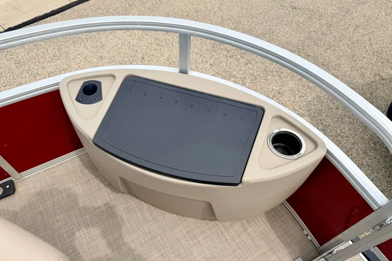 Slide: The Image of 2022 Sun Tracker Bass Buggy 18 DLX boat console with cup holder and ruler. - 58
