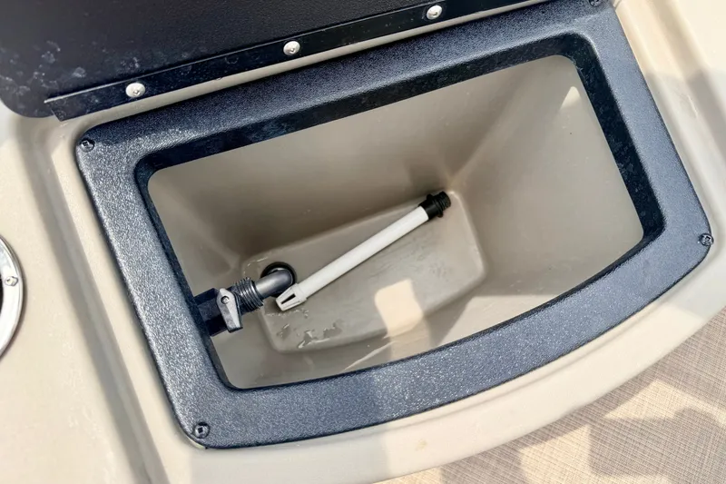 Slide: The Image of Open storage compartment on 2022 Sun Tracker Bass Buggy 18 DLX boat. - 25