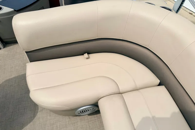 Slide: The Image of 2022 Sun Tracker Bass Buggy 18 DLX beige seating with integrated speaker. - 33