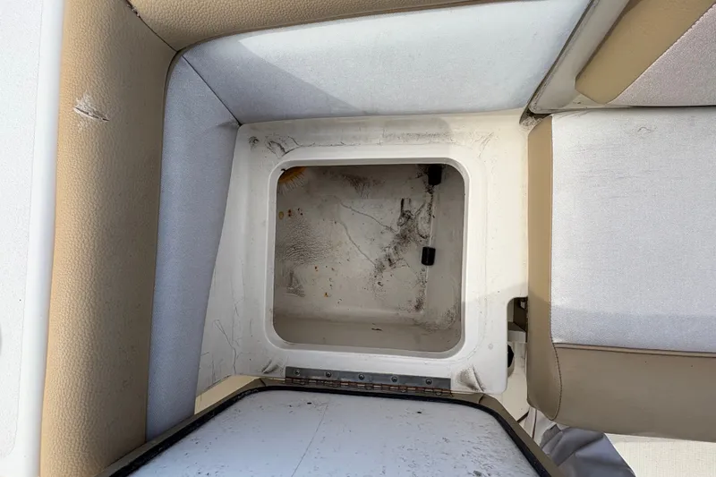Slide: The Image of Storage compartment on a 2014 Scout 225 XSF boat with cushioned seating. - 15