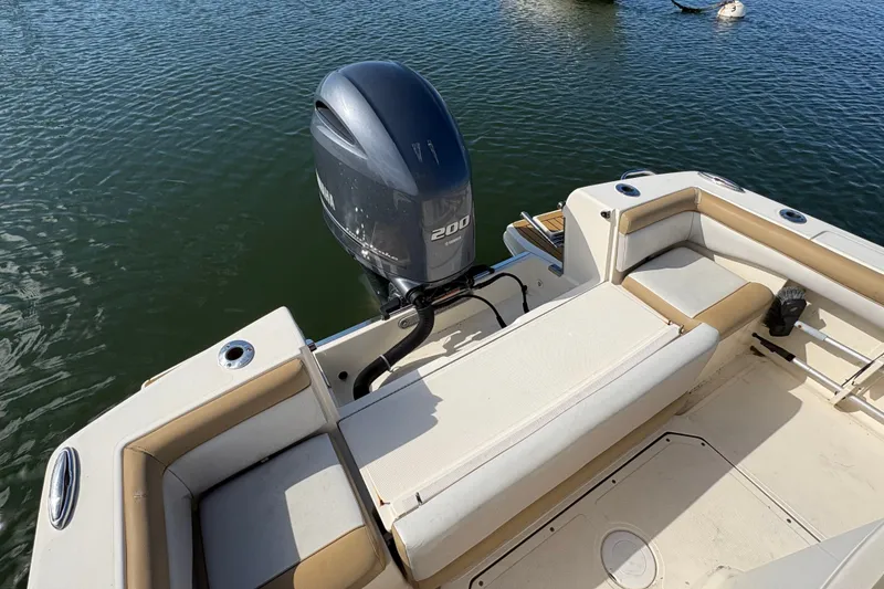 Slide: The Image of 2014 Scout 225 XSF boat with Yamaha 200 outboard motor on calm water. - 10