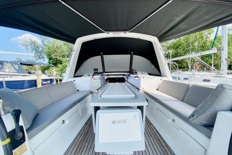 Slide: The Image of 2016 Beneteau Oceanis 41 yacht interior with seating and canopy, docked at marina. - 19