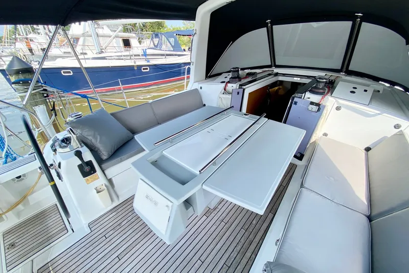 Slide: The Image of Spacious cockpit of 2016 Beneteau Oceanis 41 sailboat with seating and table. - 20