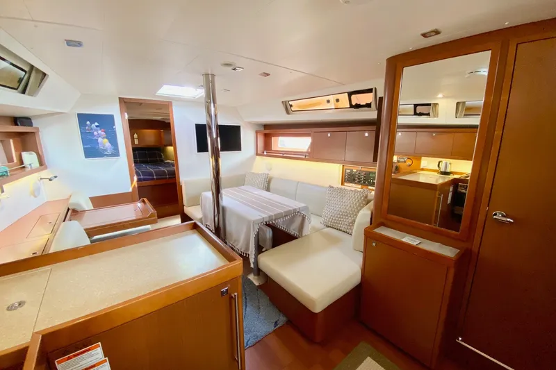 Slide: The Image of Interior of 2016 Beneteau Oceanis 41 yacht, featuring cozy seating and modern amenities. - 29
