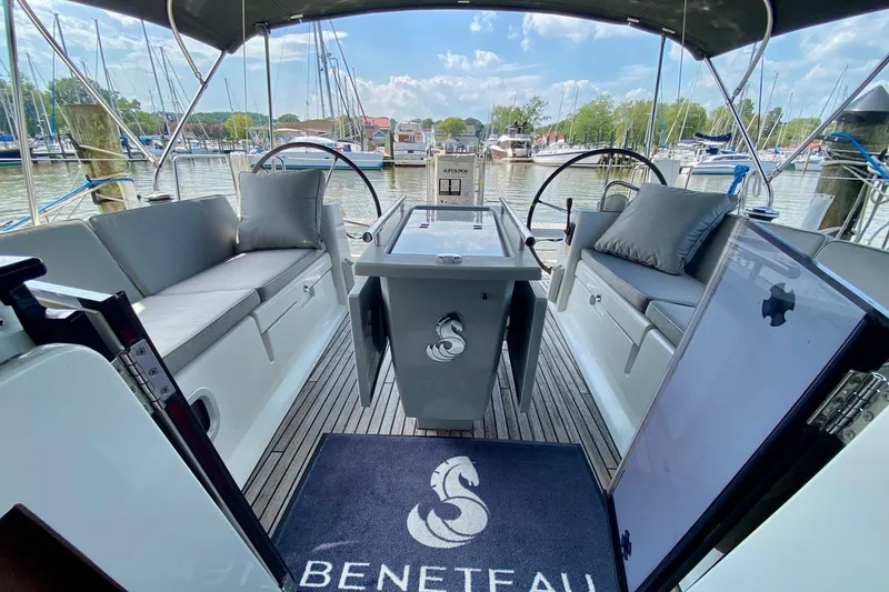 Slide: The Image of Interior view of 2016 Beneteau Oceanis 41 sailboat cockpit with seating and steering wheels. - 16