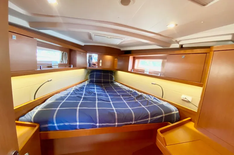 Slide: The Image of Luxurious cabin interior of 2016 Beneteau Oceanis 41 yacht with cozy bedding. - 43