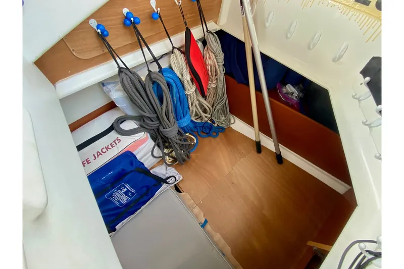 Slide: The Image of Storage area on a 2016 Beneteau Oceanis 41 sailboat with ropes and life jackets. - 38