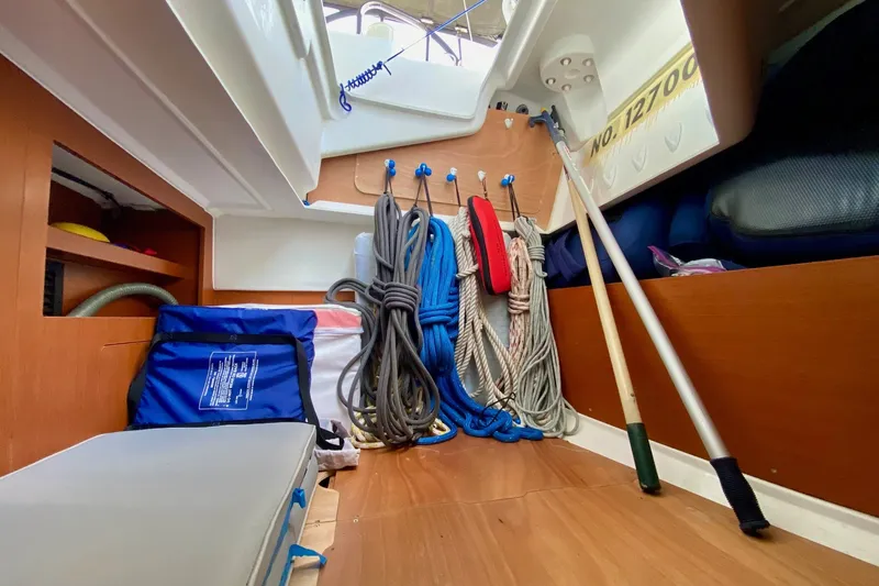 Slide: The Image of Storage area in a 2016 Beneteau Oceanis 41 sailboat with ropes and equipment. - 37