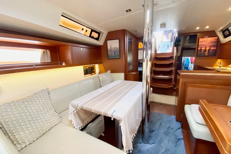 Slide: The Image of Interior of 2016 Beneteau Oceanis 41 yacht with elegant dining area and modern decor. - 40