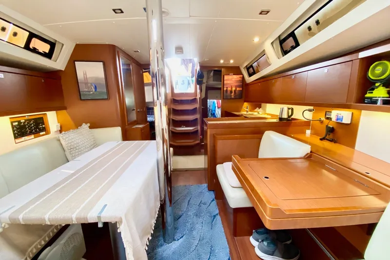 Slide: The Image of Interior of 2016 Beneteau Oceanis 41 yacht, featuring elegant wood finishes and modern amenities. - 39