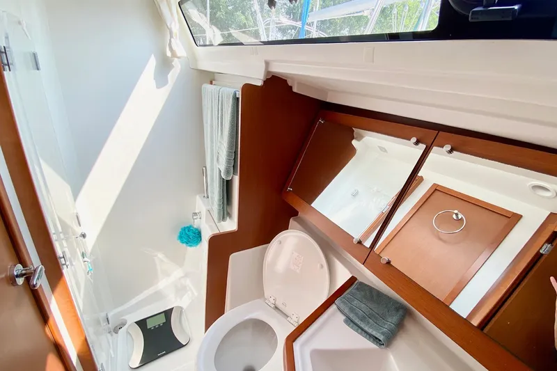 Slide: The Image of Bathroom interior of 2016 Beneteau Oceanis 41 yacht, featuring modern fixtures and wooden cabinetry. - 46