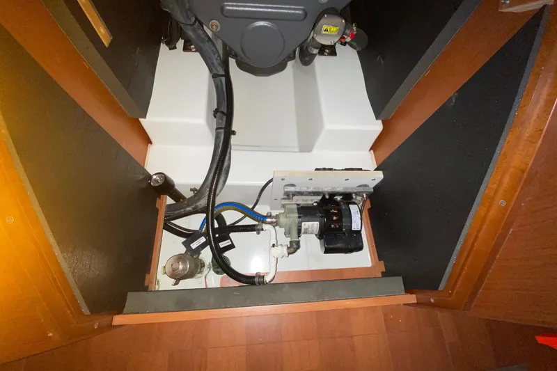 Slide: The Image of Engine compartment of a 2016 Beneteau Oceanis 41 sailboat, showcasing mechanical components. - 52