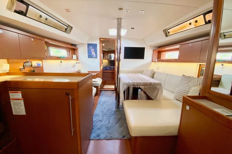 Slide: The Image of Interior of 2016 Beneteau Oceanis 41 yacht, featuring cozy seating and modern amenities. - 27