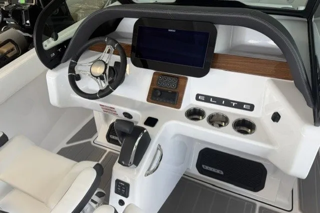 Slide: The Image of 2027 Monterey Elite 23 SD boat dashboard with steering wheel and digital display. - 32