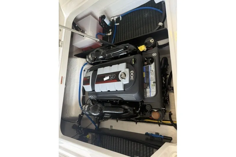 Slide: The Image of Engine compartment of 2027 Monterey Elite 23 SD boat, showcasing powerful motor components. - 20