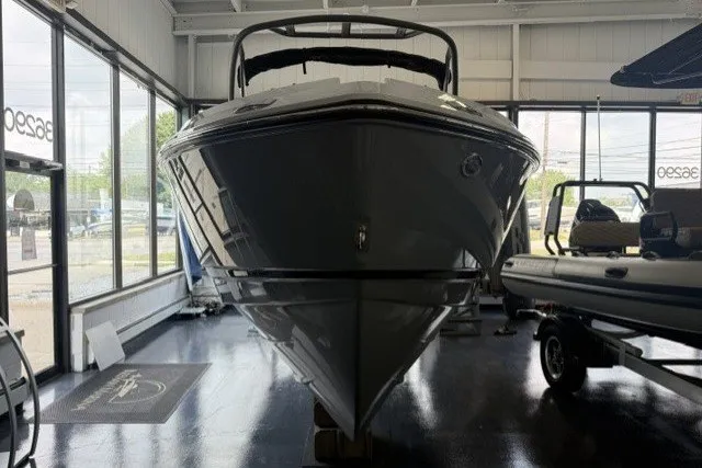 Slide: The Image of 2027 Monterey Elite 23 SD boat displayed in a showroom, front view. - 22