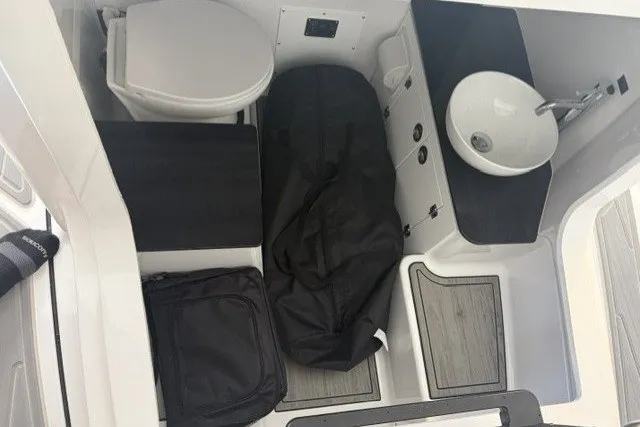 Slide: The Image of Interior of 2027 Monterey Elite 23 SD boat with toilet and sink. - 35