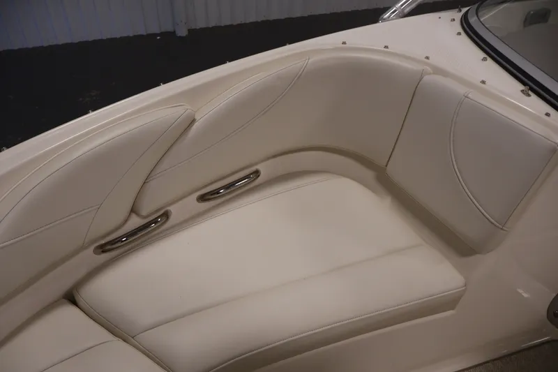 Slide: The Image of 2008 Maxum 1900 SR3 boat interior with cream leather seating and stainless steel accents. - 14