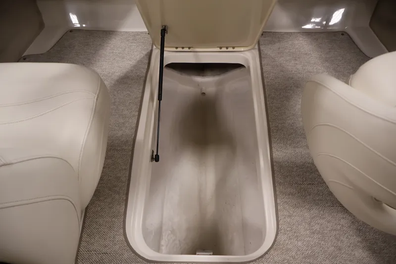 Slide: The Image of Storage compartment in 2008 Maxum 1900 SR3 boat, featuring beige interior and carpeted flooring. - 28