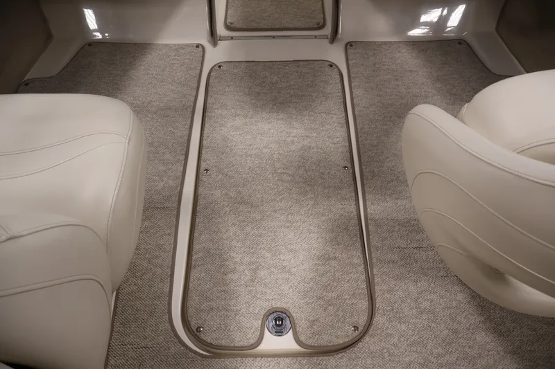 Slide: The Image of 2008 Maxum 1900 SR3 boat interior with beige carpet and white seating. - 27